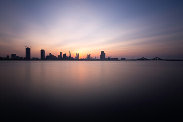 Fototapeta premium A beautiful view of Bahrain skyline during evening hours at sunset