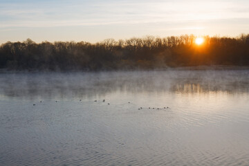 Sunset river horizon sky clouds. River sunset landscape. Sunset river view. Sunset river panorama