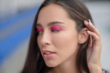 Headshot of a pretty girl with bright eyeshadows