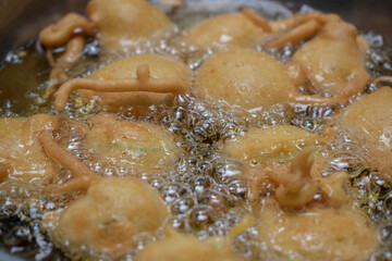 FRYING INDIAN SUBCONTINENT FOOD PAKORA (ALOO BHAJIYA)