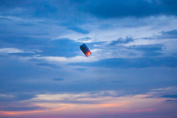 Fototapeta na wymiar Floating lanterns in the evening sky.