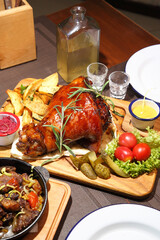 Baked pork knee. Fried beef liver with onions. Beer pub. Sports bar. Horseradish vodka and pork knee. Pork knee, vegetables and horseradish. 