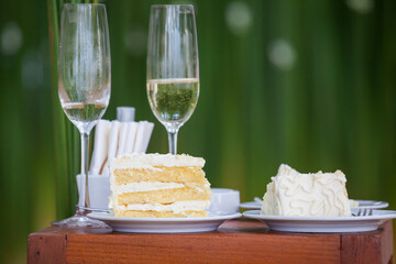 The wedding cake is cut into pieces.