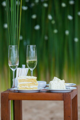 The wedding cake is cut into pieces.