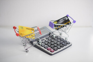 shopping cart with credit card ,Calculator ,shopping online concept