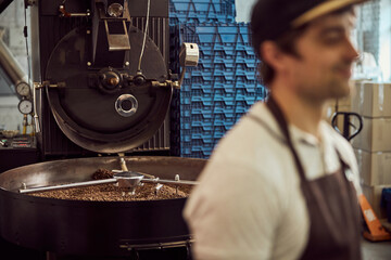 Industrial coffee roasting machine and male worker