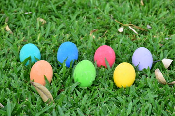 Fototapeta na wymiar Closeup of Variety of colorful Easter eggs on grass at Thailand.