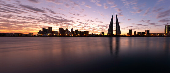 Fototapeta premium WTC, High rise building with wind turbine to minimise the emission of greenhouse gases