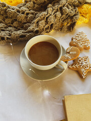 Cappuccino, gingerbread and knitted scarf