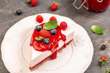 Summer raspberry and blueberry no bake cheesecake, banner menu recipe place for text, top view
