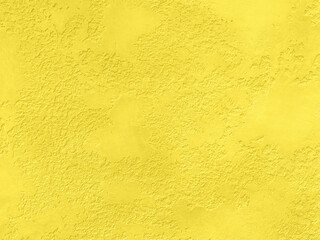Saturated yellow colored low contrast Concrete textured background with roughness and irregularities. 2021 color trend.