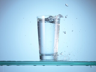 Dropping ice cube into glass