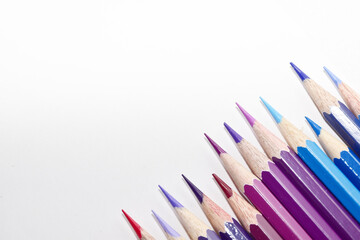 Many Color pencils isolated on white background close up. Color pencils for drawing as a background