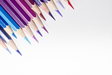 Many Color pencils isolated on white background close up. Color pencils for drawing as a background