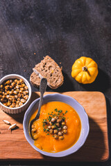 Homemade pumpkin soup with crispy roasted chickpeas