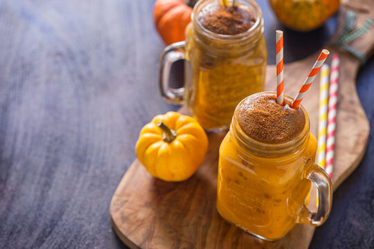 Pumpkin smoothie with cinnamon in a jar	