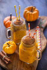 Pumpkin smoothie with cinnamon in a jar	