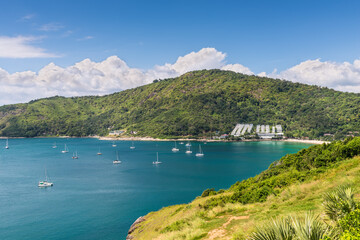 Fototapeta na wymiar Beautiful seascape view. Exotic turquoise ocean with boats, blue sea, blue sky and Nai Han Beach from view point in Phuket, Thailand. Panorama of travel summer holiday background concept.