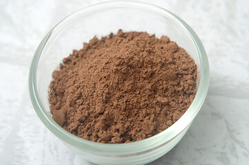 Obraz na płótnie Canvas cocoa powder in a glass bowl