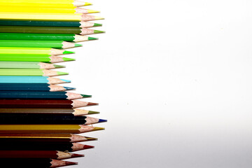 Many Color pencils isolated on white background close up. Color pencils for drawing as a background