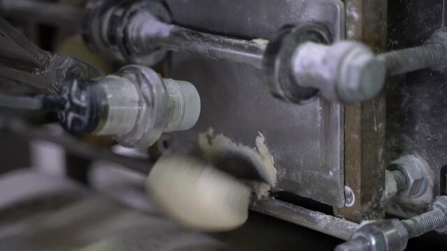Close of shot of arabic bread production in a machine.Arabic bread production