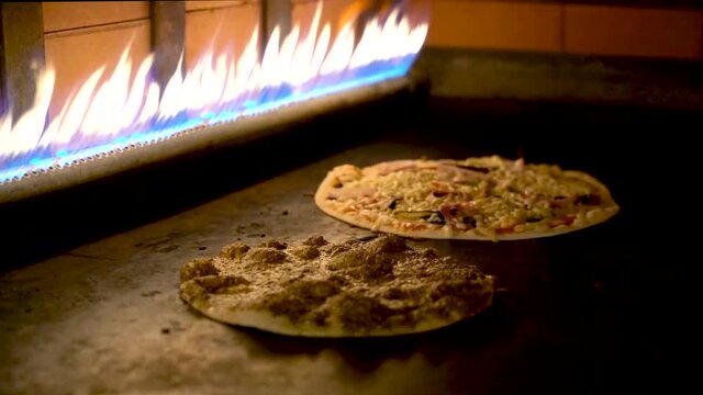 Close up of Lebanese Arabian Pizza cooking in the oven and the cheese melting