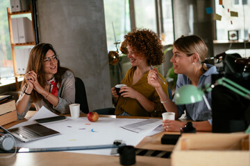 Businesswomen working on a new project. Colleagues discussing about problem they have to solved.