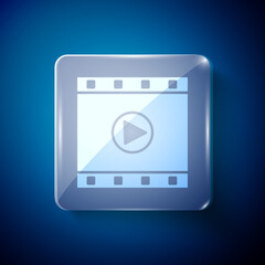 White Play Video icon isolated on blue background. Film strip sign. Square glass panels. Vector Illustration.