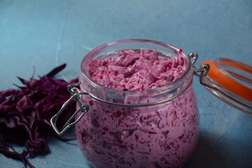 Red cabbage with mayonnaise salad in a glass jar