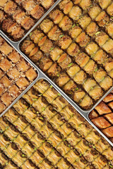 Traditional Dessert Turkish Baklava. Walnut, Pistachio Turkish Style Antep Baklava Presentation. Baklava from Turkish cuisine.