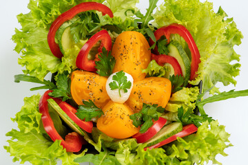 Vegetable salad is a low-calorie cold vegetarian snack. The dish contains the following ingredients: mozzarella, tomatoes, bell pepper, cucumber and lettuce.