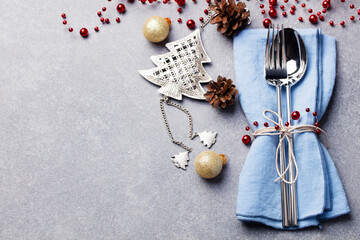 Christmas and New Year holiday table setting. Celebration place setting for dinner decorations. Copy space. Top view.