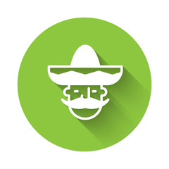 White Mexican man wearing sombrero icon isolated with long shadow. Hispanic man with a mustache. Green circle button. Vector.