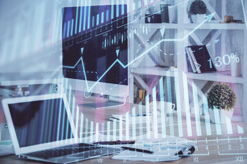 Financial market graph hologram and personal computer on background. Multi exposure. Concept of forex.