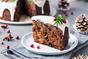 Christmas fruit cake, pudding on white plate. Close up.