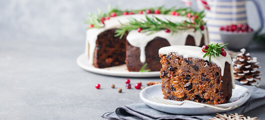 Christmas fruit cake, pudding on white plate. Close up. Copy space.