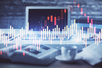 Stock market chart hologram drawn on personal computer background. Multi exposure. Concept of investment.