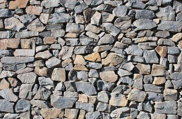 Gray and colourful stone wall background, texture