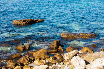 Summer beach day. Landscape of sea coast with beautiful rocks.