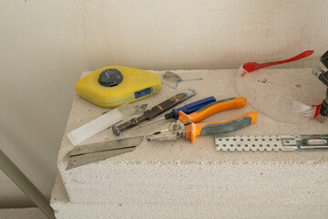 Construction tools on dirty table, mechanical tools.