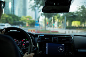 Driving car on city road awaiting in front of the zebra crossing