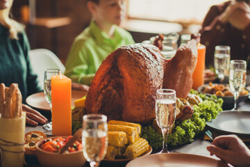 Served table thanks giving dinner garnished turkey family multi generation gathering evening blessing living room indoors