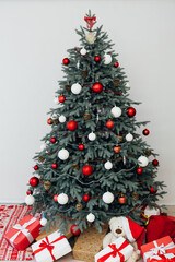 Christmas tree with gift decor pine on new year interior background postcard holiday winter