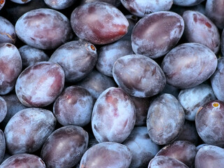 Ripe fruits of plum as background