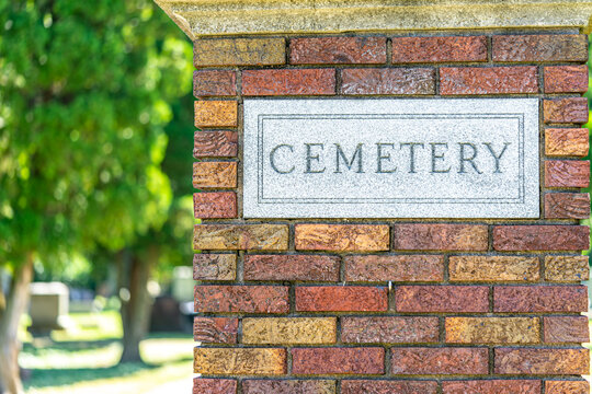 Cemetery gate pillar with cemetery engraved into the plaque.  Brick