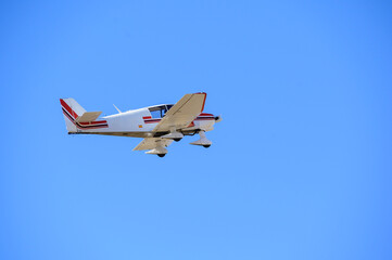 plane flying over blue sky
