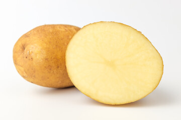 Raw potatoes on a white background