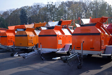 Asphalt recyclers parked in row during exhibition