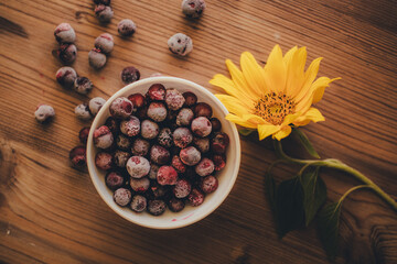 Still life. Frozen cherries on wooden background
