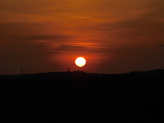 View of sunset over the dark plants